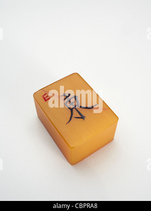 A Mahjong tile, representing the East wind. Stock Photo