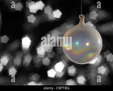 multicolored translucent Christmas bauble in blurry back Stock Photo