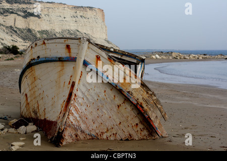 An old Cypriot fising boat sunk in to the sands, Cyprus Stock Photo