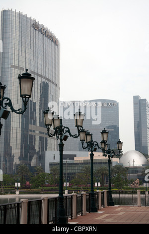 Venetian lampposts outside the Venetian Casino and Hotel Complex with the City of Dreams behind Cotai Strip Macau SAR China Stock Photo