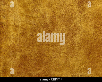 A tanned suede leather background. Stock Photo