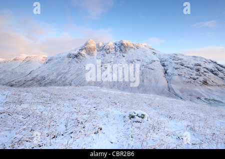 Winter view of the Langdale Pikes covered in snow in the English Lake District, taken from the Band on Bowfell. Stock Photo