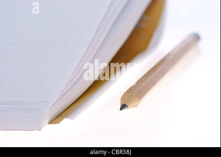 empty notebook and pencil isolated on white background Stock Photo