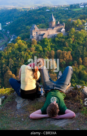 Young couple looking at scenery above Bacharach village on Romantic River Rhine in Germany Stock Photo