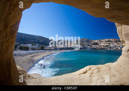 Matala beach seen from inside a cliff cave, Matala, Crete, Greece. Stock Photo