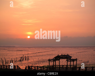 Beautiful sunset at Cigu Bay on the southwest coast of Taiwan Stock Photo