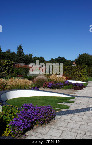 COLOURFUL AUTUMN FLOWER BEDS WITHIN THE WALLED GARDEN AT MARKS HALL IN ESSEX. Stock Photo