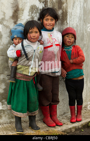 Group Of Dirty And Poorly Dressed Kid Due To The Lack Of Education And Basic Hygiene Services Living In A Rural Area Stock Photo