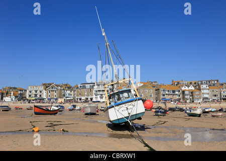 St Ives, Cornwall, England, UK, Great Britain. View of moored boats beached in the sandy harbour at low tide Stock Photo