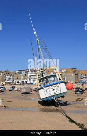 St Ives, Cornwall, England, UK. View of moored boats beached in the sandy harbour at low tide Stock Photo