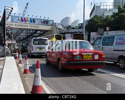 dh Harbour Tunnel CAUSEWAY BAY HONG KONG Red taxi car busy traffic entering Cross Harbour Tunnel island Stock Photo