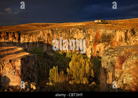 Cappadocia, Aksaray, Turkey. The entrance of Ihlara Valley under heavy, cloudy sk Stock Photo
