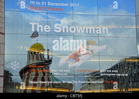 Funfair reflected in window of ICC and Symphony Hall, Centenary Square, Birmingham, West Midlands, England, United Kingdom Stock Photo