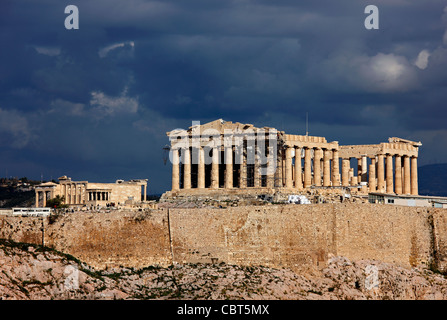 The Parthenon and the Erechtheion of the Acropolis of Athens under a cloudy sky. Stock Photo