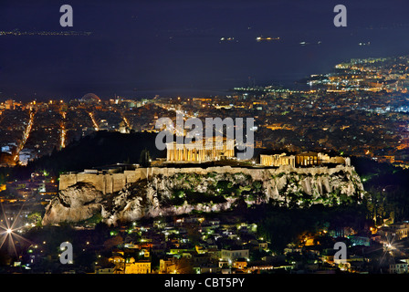The Acropolis of Athens at night. View from Lycabettus hill. View all the way down to Piraeus and the Saronic gulf. Greece