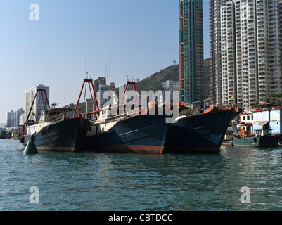 dh Aberdeen Harbour ABERDEEN HONG KONG Fishing junks in Aberdeen harbour anchorage high rise residential flats Stock Photo