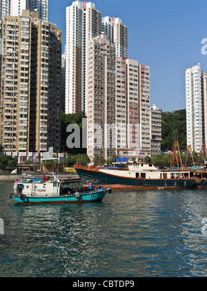 dh Chinese Fishing junks ABERDEEN HONG KONG Boats In harbour anchorage residential flats houses south china sea harbor Stock Photo