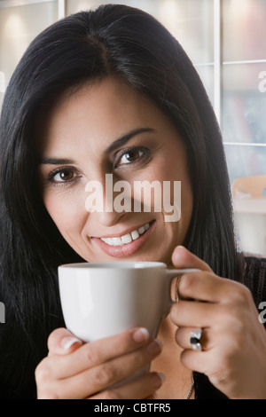 Turkish woman drinking coffee Stock Photo