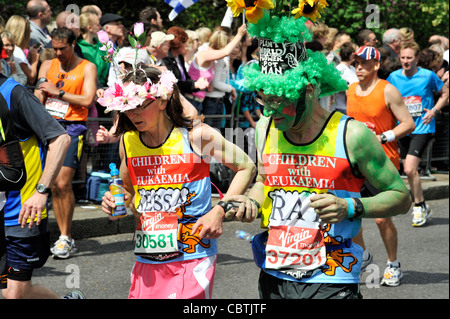 runners in fancy dress at london marathon Stock Photo