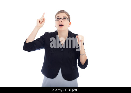Surprised young woman pointing up, isolated on white background. Stock Photo