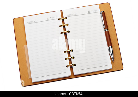 Open notebook with copper binding and stylish pen. It is isolated on a white background Stock Photo