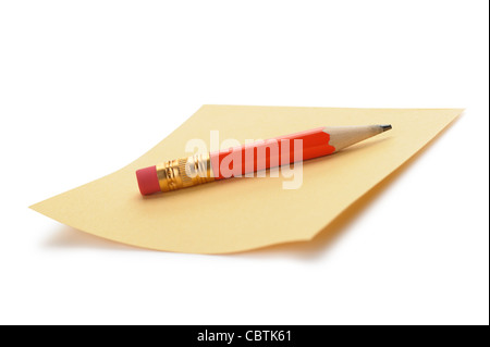Paper note and a red pencil. It is isolated on a white background Stock Photo
