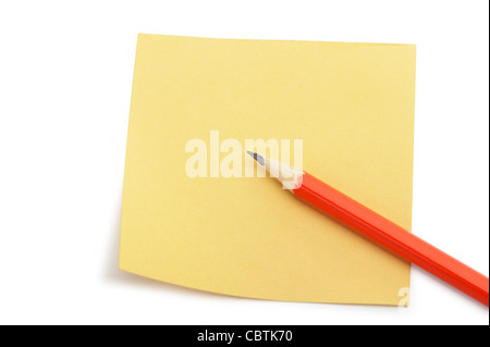 Paper note and a red pencil. It is isolated on a white background Stock Photo