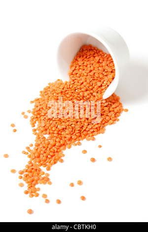 Red lentils on a white bg Stock Photo