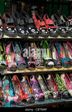 Brightly coloured ladies shoes on a market stall Stock Photo