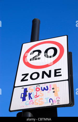 20 miles per hour speed limit zone road sign Stock Photo