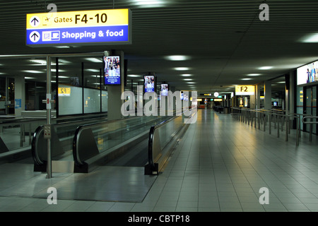 Direction signs at Schiphol Airport Stock Photo - Alamy