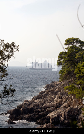 Cruise liner sailing past the coast of Lokrum Island Dubrovnik Dalmatia Croatia Stock Photo