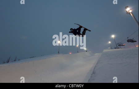 Snowboarder making tricks in the superpipe of Ruka, Kuusamo, Finland Stock Photo