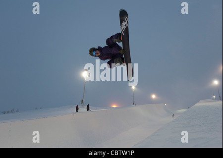 Snowboarder making tricks in the superpipe of Ruka, Kuusamo, Finland Stock Photo