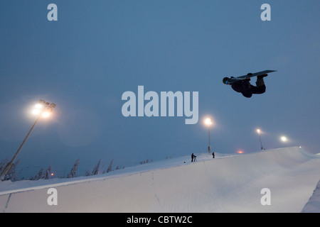 Snowboarder making tricks in the superpipe of Ruka, Kuusamo, Finland Stock Photo