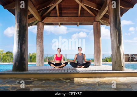 Couple practicing yoga together Stock Photo