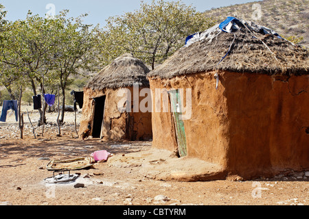 Family home with sacred fire in a Herero village, Damaraland, Namibia Stock Photo