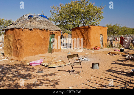 Family home with sacred fire in a Herero village, Damaraland, Namibia Stock Photo