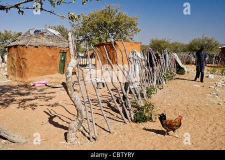 Family home with sacred fire in a Herero village, Damaraland, Namibia Stock Photo