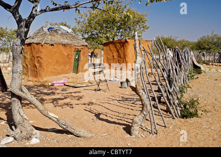 Family home with sacred fire in a Herero village, Damaraland, Namibia Stock Photo