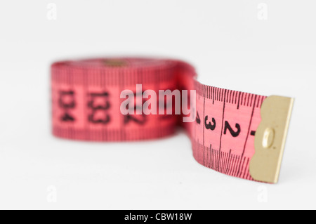 Pink tape measure roll isolated on the white background Stock Photo - Alamy