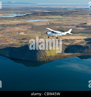 Cessna flying over South Coast Iceland Stock Photo