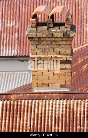 The older houses in Brisbane were usually made of timber with a brick chimney and a corrugated iron roof Stock Photo