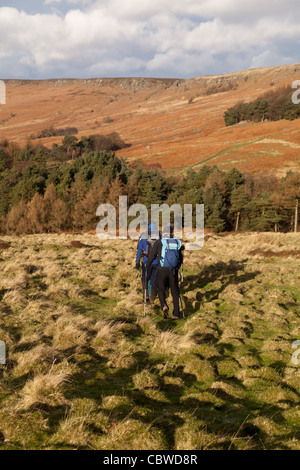 Walkers on Carhead Rocks looking towards Stanage Edge in the Peak District National Park, Derbyshire,UK Stock Photo