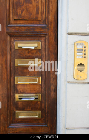 Mailboxes and intercom in brass. Stock Photo