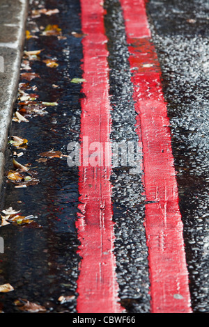 Double red lines / road markings Stock Photo - Alamy