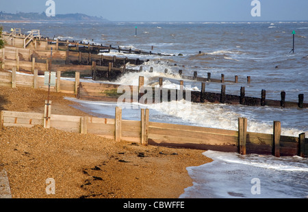 Wooden groynes and waves, Felixstowe, Suffolk, England Stock Photo