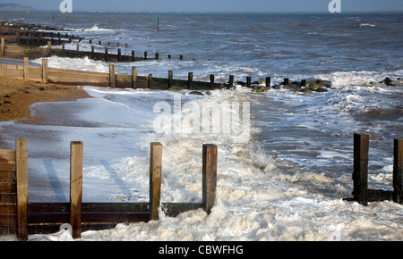 Wooden groynes and waves, Felixstowe, Suffolk, England Stock Photo