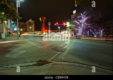 Nighttime view of San Antonio River Walk Christmas lights, Friendship Torch and Tower of America. Stock Photo