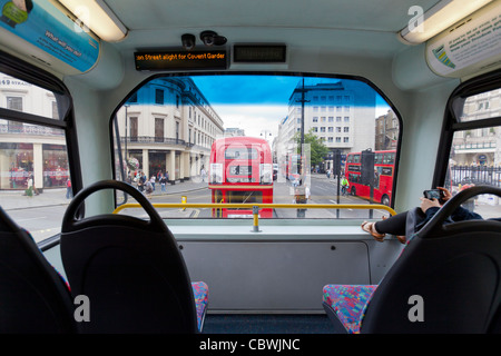 Riding on a double decker bus in Central London. Stock Photo